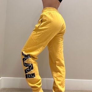 Ivy Park yellow sweatpants with Ivy Park logo on leg. Size S.